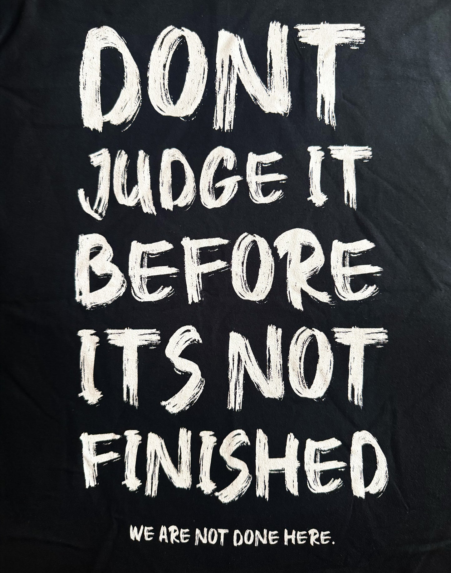 Black Unisex Premium Heavyweight Back-Design Tee "Before It's Not Finished" by Designer and Artist Lucas Gillon