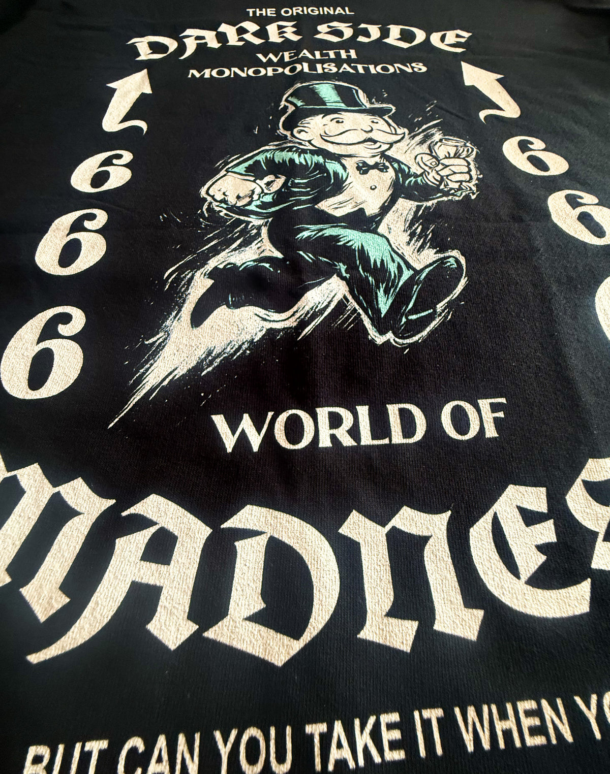 Black Unisex Premium Heavyweight Back-Design Tee "Dark Side - Wealth Monopolisations" by Designer and Artist Lucas Gillon