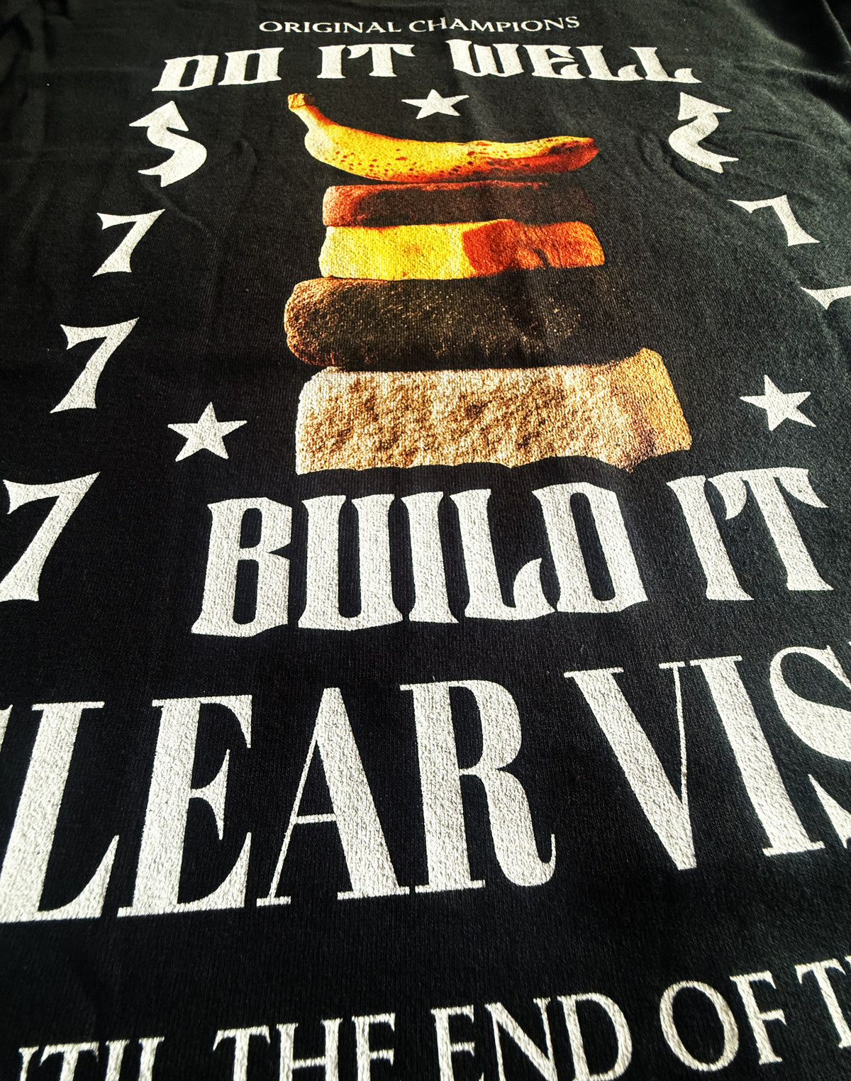 Black Unisex Premium Heavyweight Back-Design Tee "777 - Do It Well" by Designer and Artist Lucas Gillon