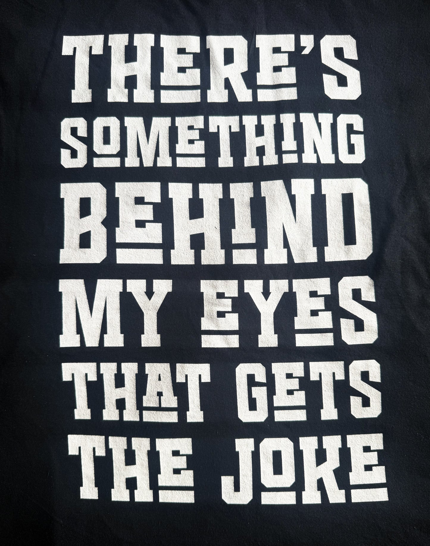 Black Unisex Premium Original Heavyweight Back-Design Tee "The Joke" by Designer and Artist Lucas Gillon