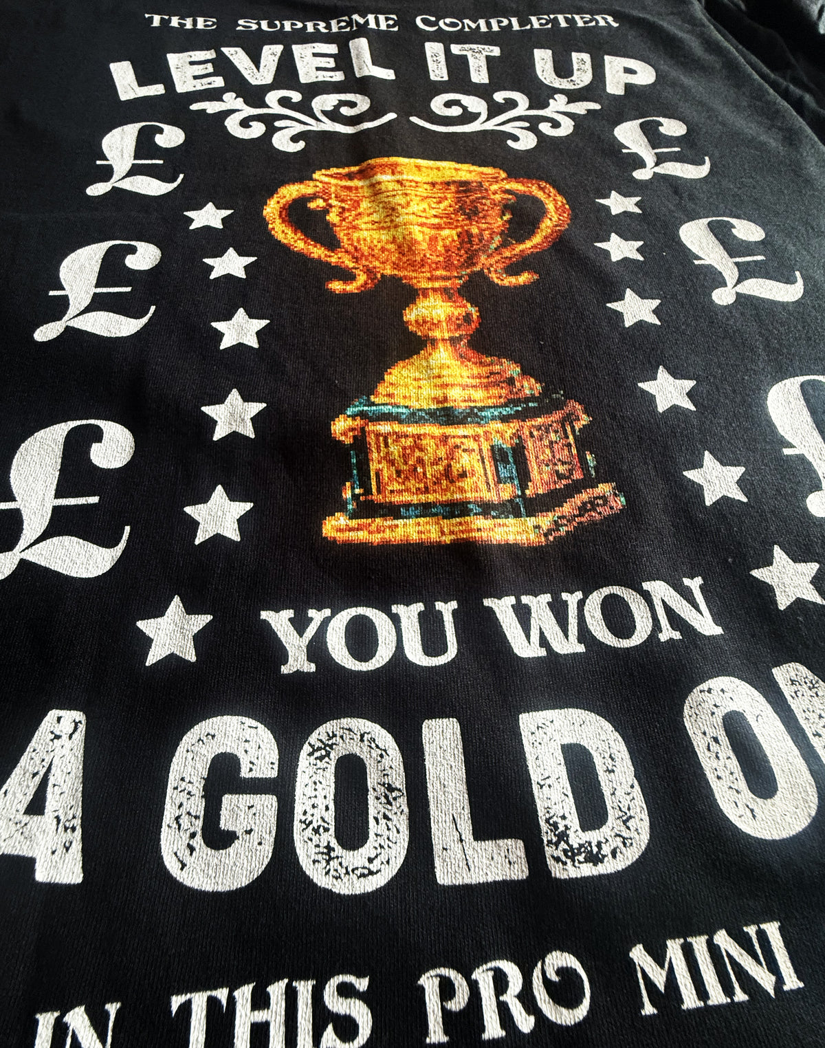 Black Unisex Premium Heavyweight Back-Design Tee "Level It Up - Gold Trophy" by Designer and Artist Lucas Gillon