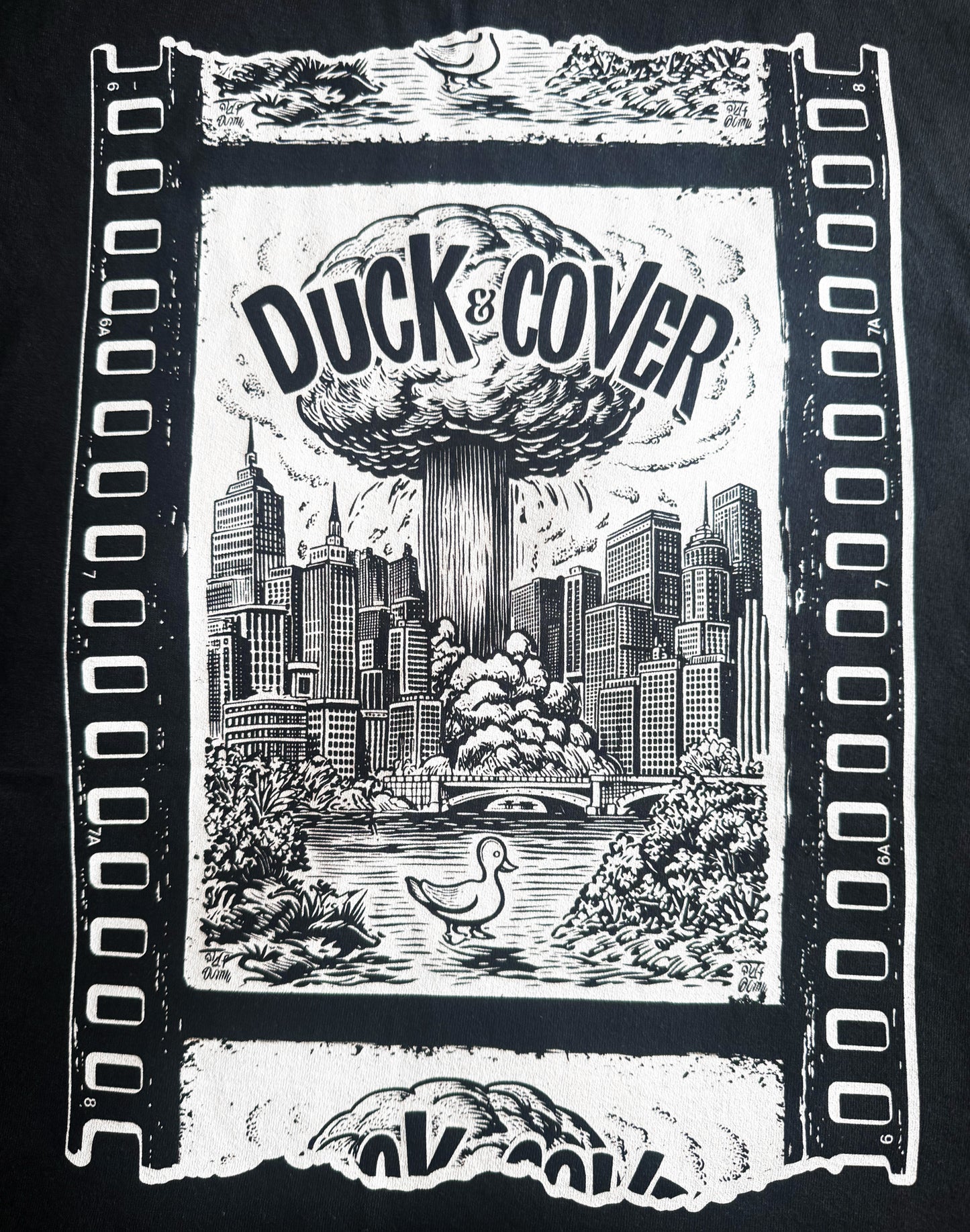 Black Unisex Premium Original Heavyweight Back-Design Tee "Duck & Cover" by Designer and Artist Lucas Gillon
