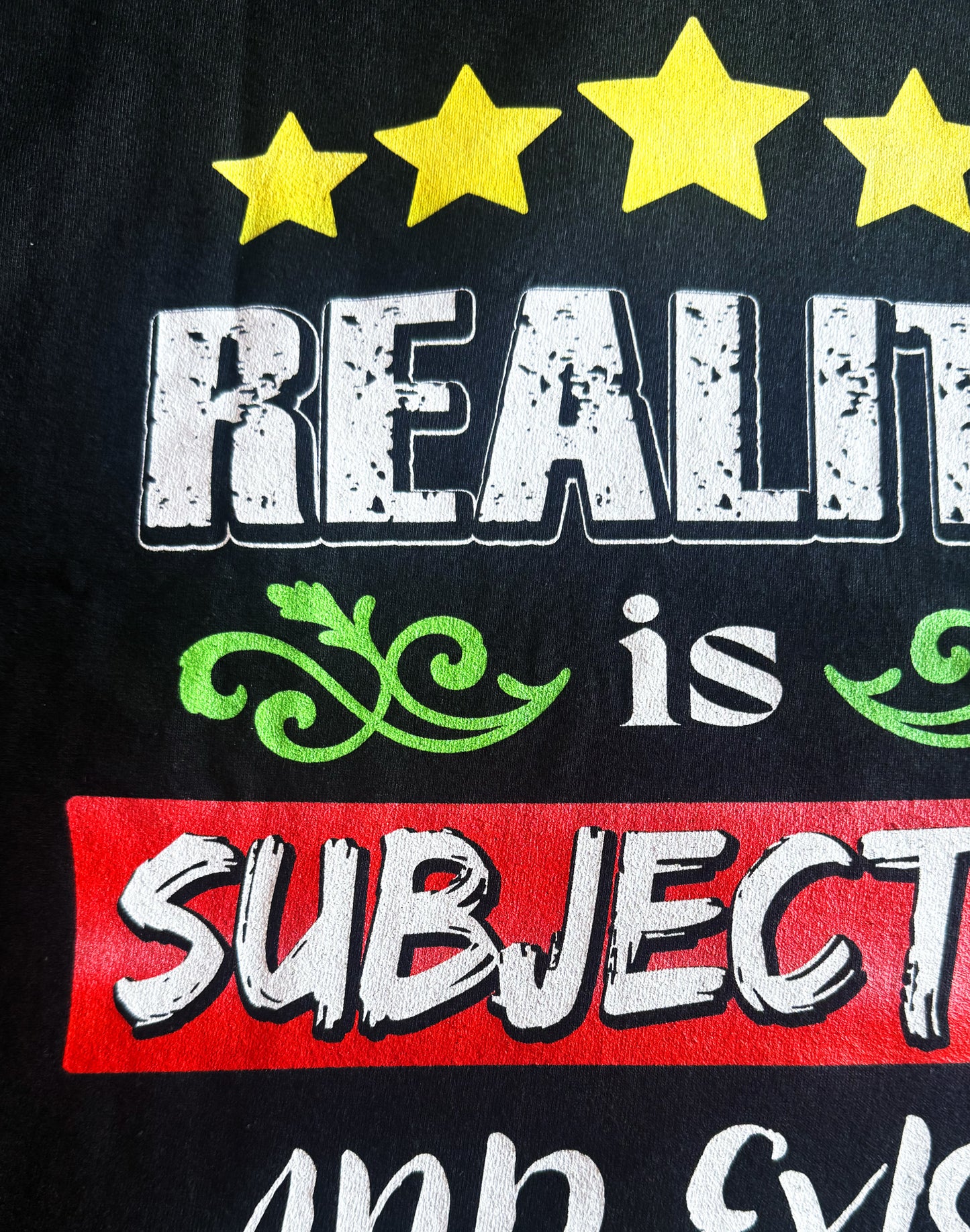 Black Unisex Premium Heavyweight Back-Design Tee "Reality is Subjective" by Designer and Artist Lucas Gillon